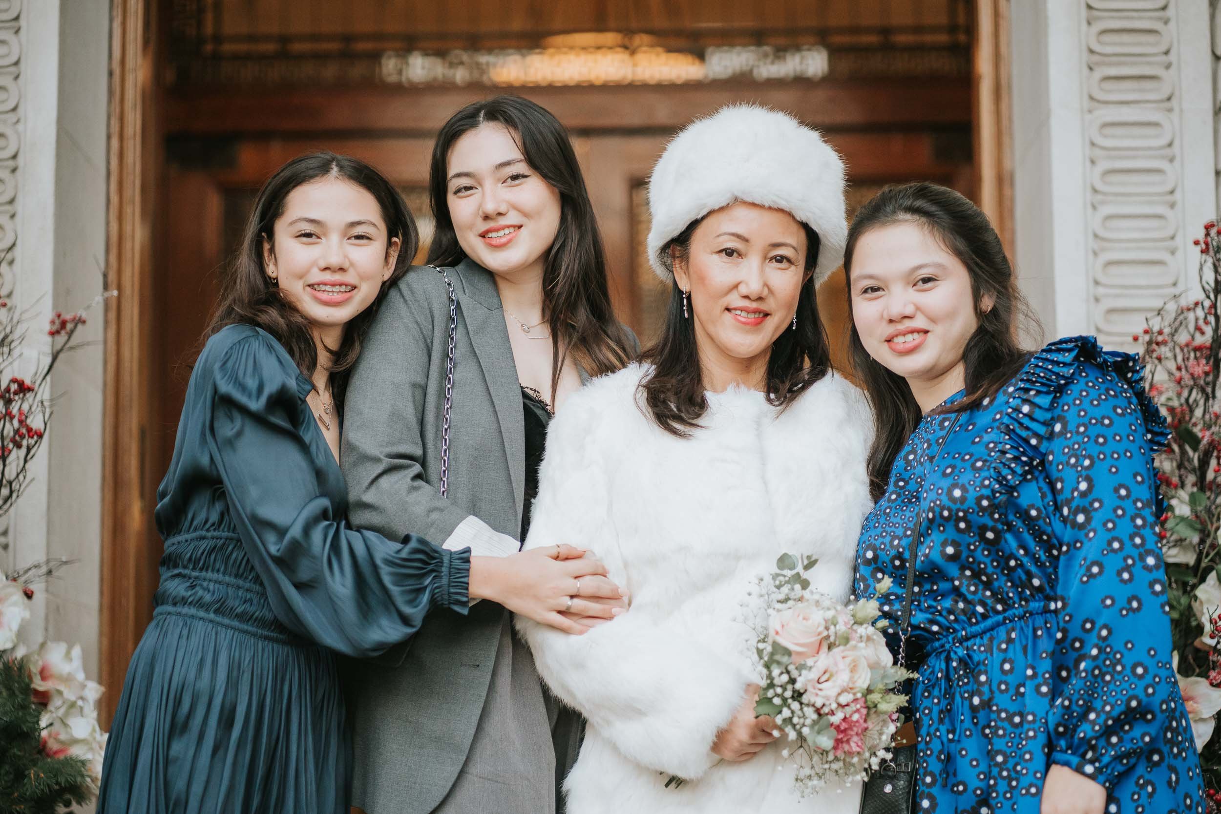  Bride and her three daughters pose outside Marylebone Old Town Hall. 