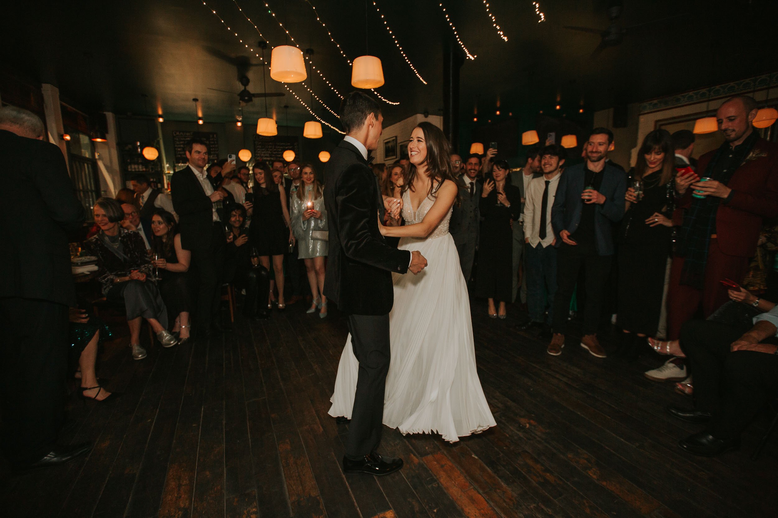  First dance of bride and groom at wedding venue Coin Laundry, Exmouth Market. 