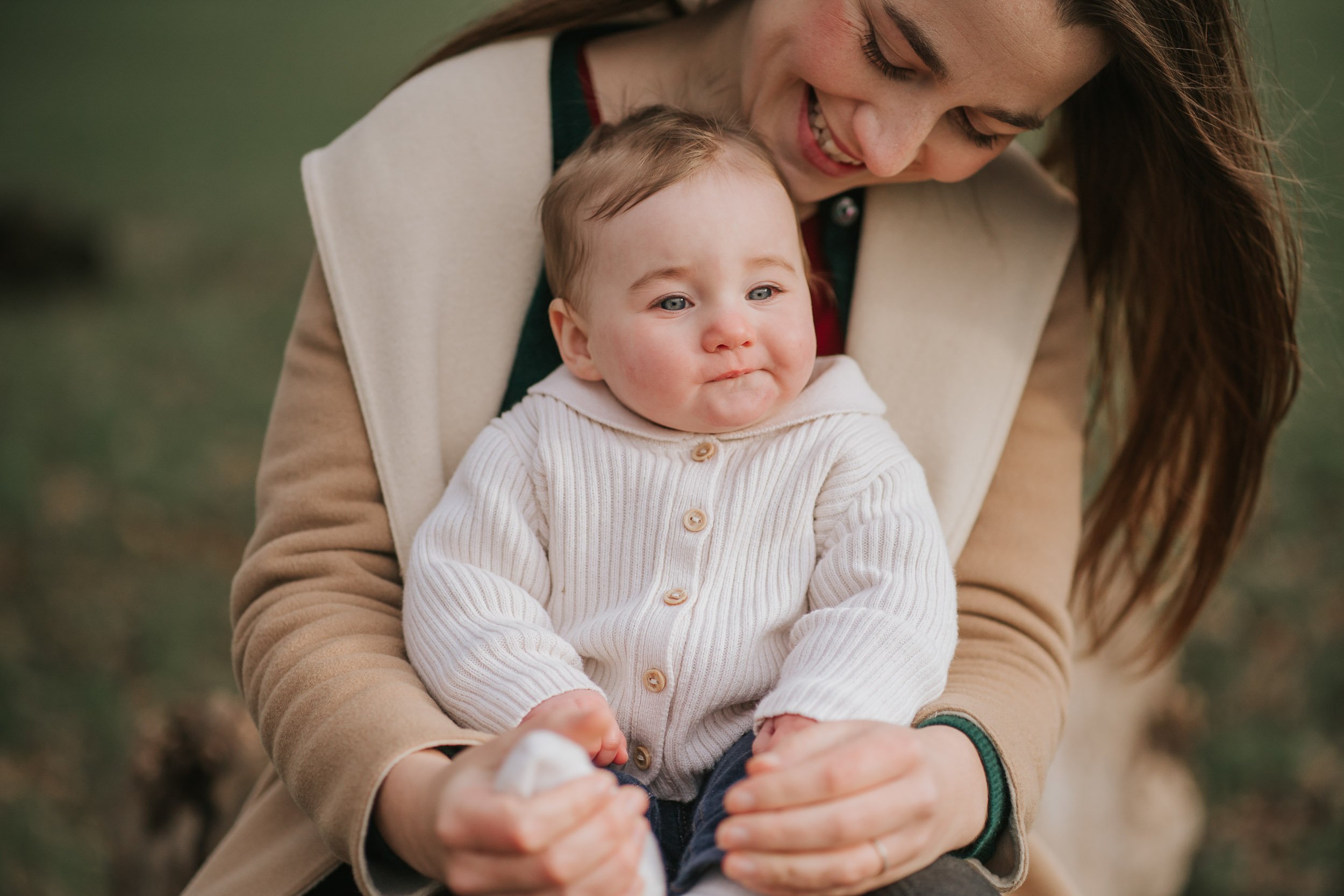  Mum and  son sitting in Brockwell Park posing for photographer christine constantine photography. 