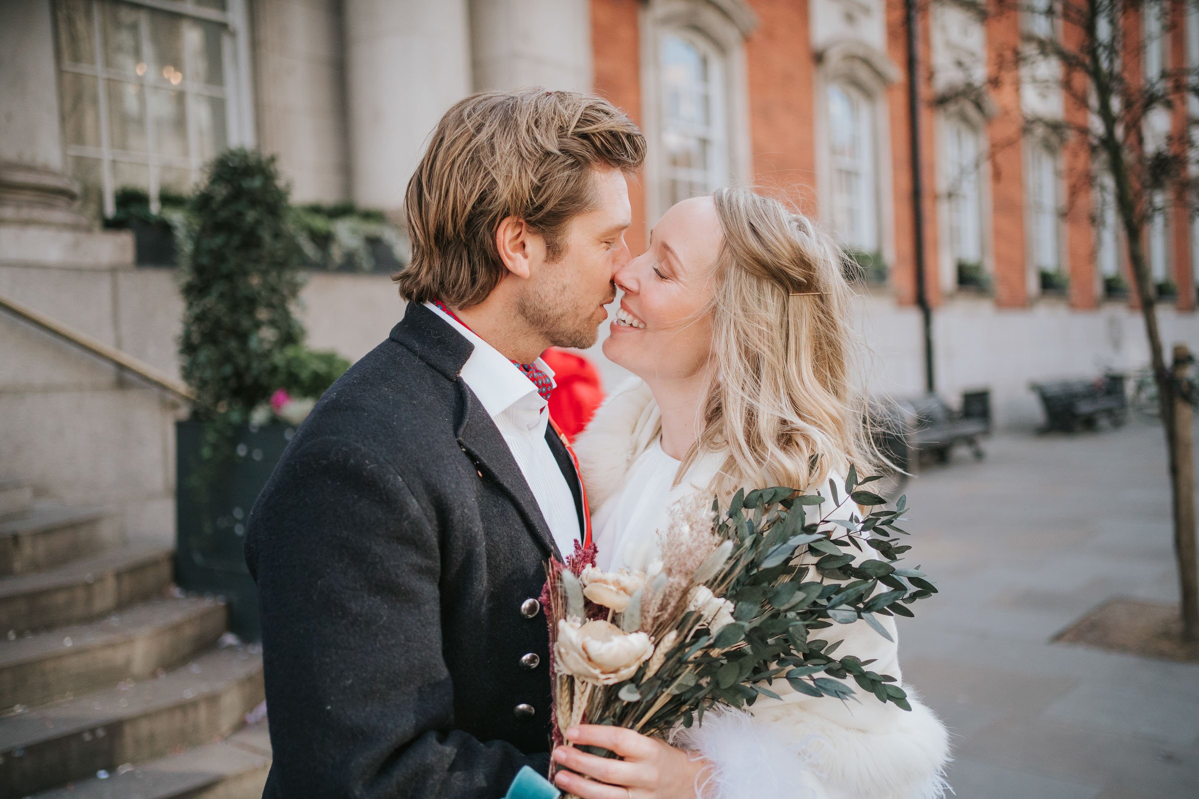  Max kisses his wife Lizzie outside Chelsea Old Town hall. 