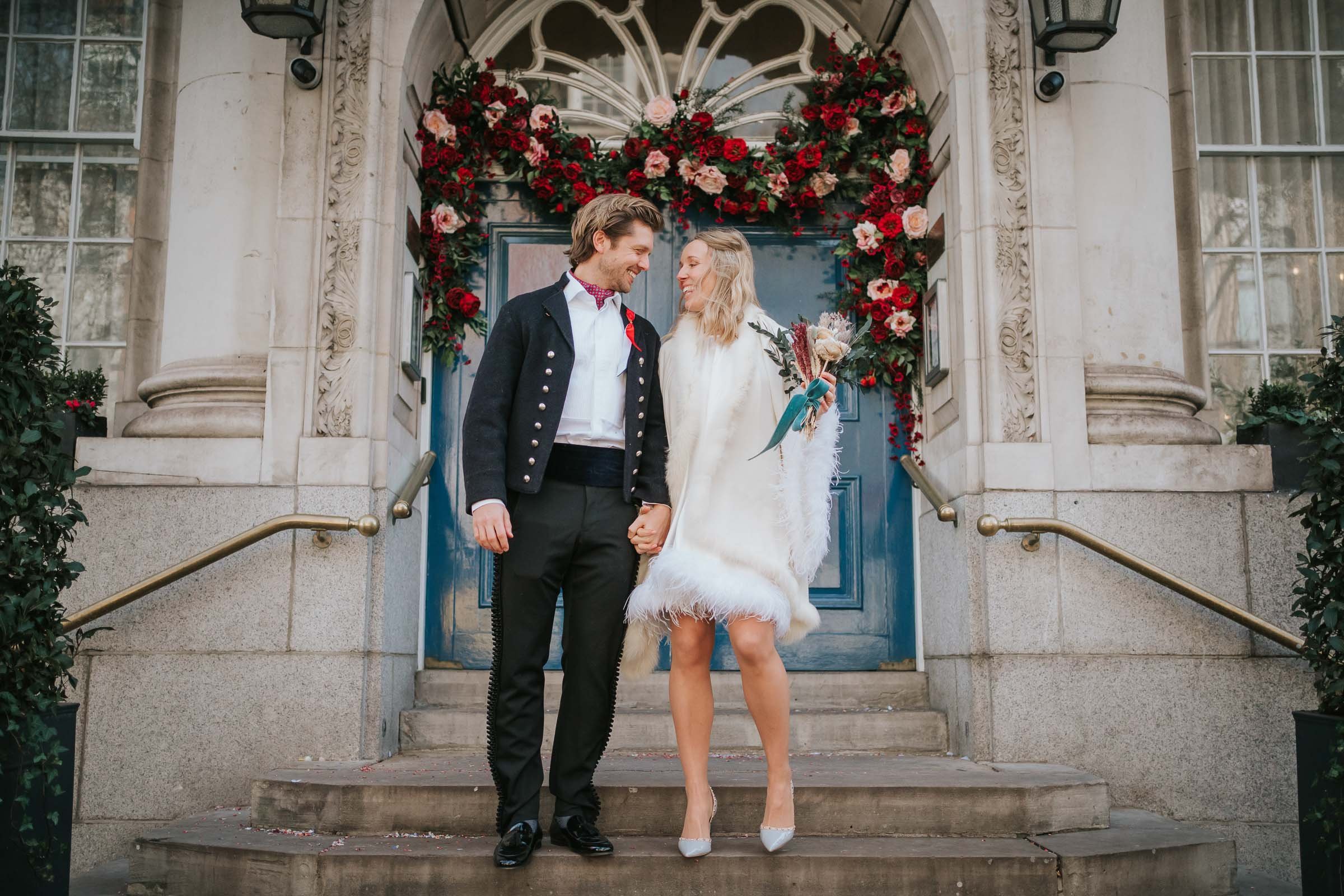  Max and Lizzie walk down the steps outside Chelsea Old Town Hall. 