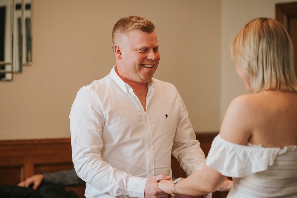  Steven and Sarah look at each other while exchanging vows at their wedding at The Elizabeth Room at Wandsworth Town Hall Registry Office. 