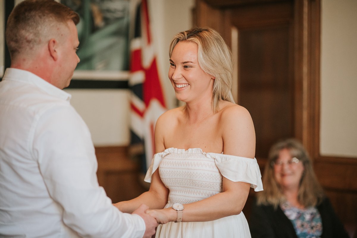  Steven and Sarah look at each other while exchanging vows at their wedding at The Elizabeth Room at Wandsworth Town Hall Registry Office. 