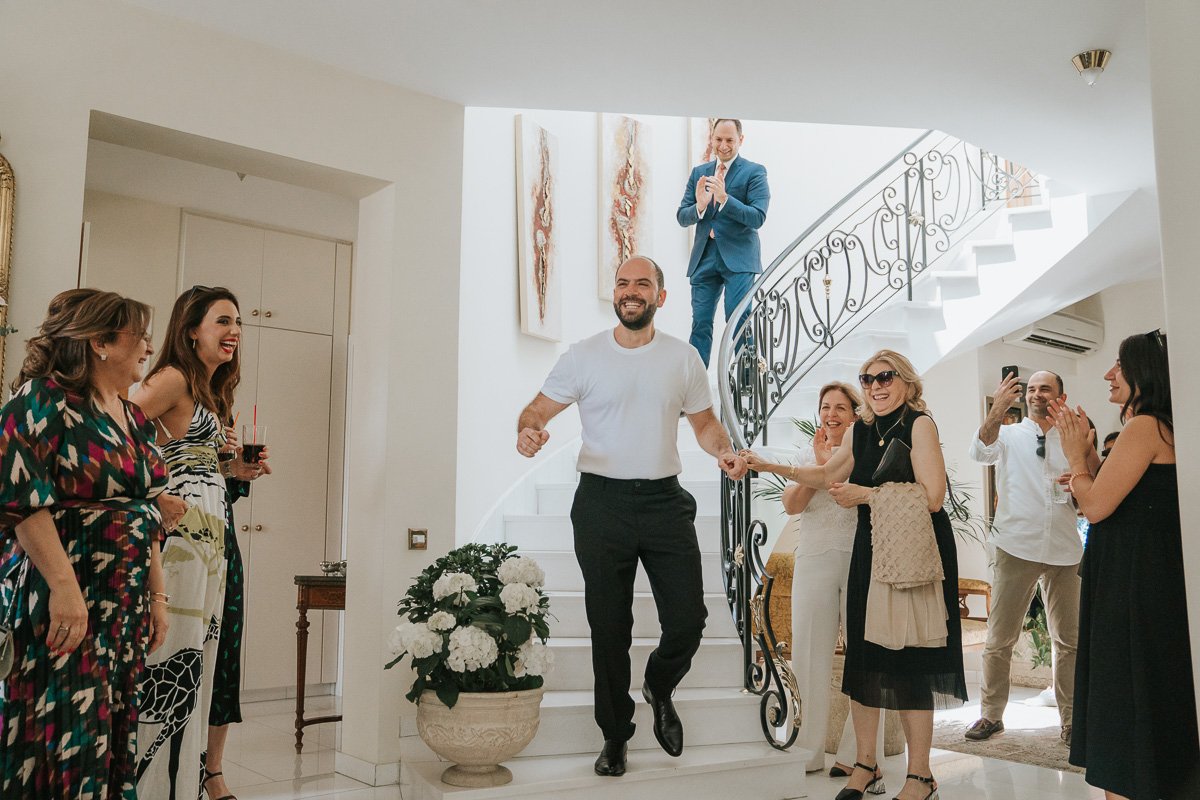  The groom coming down the stairs at his parents home in Nicosia. 