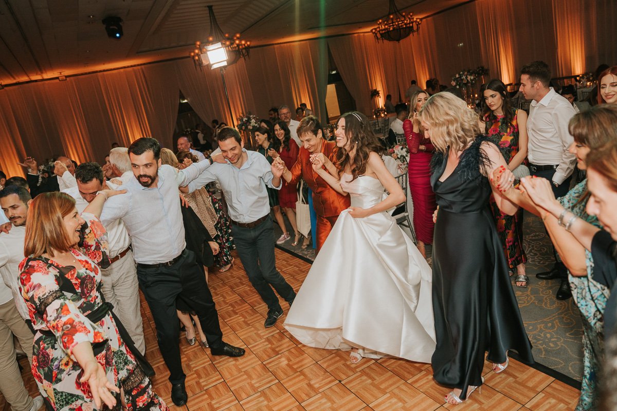  Bride and Groom and their friends and family dancing at Hilton Nicosia. 