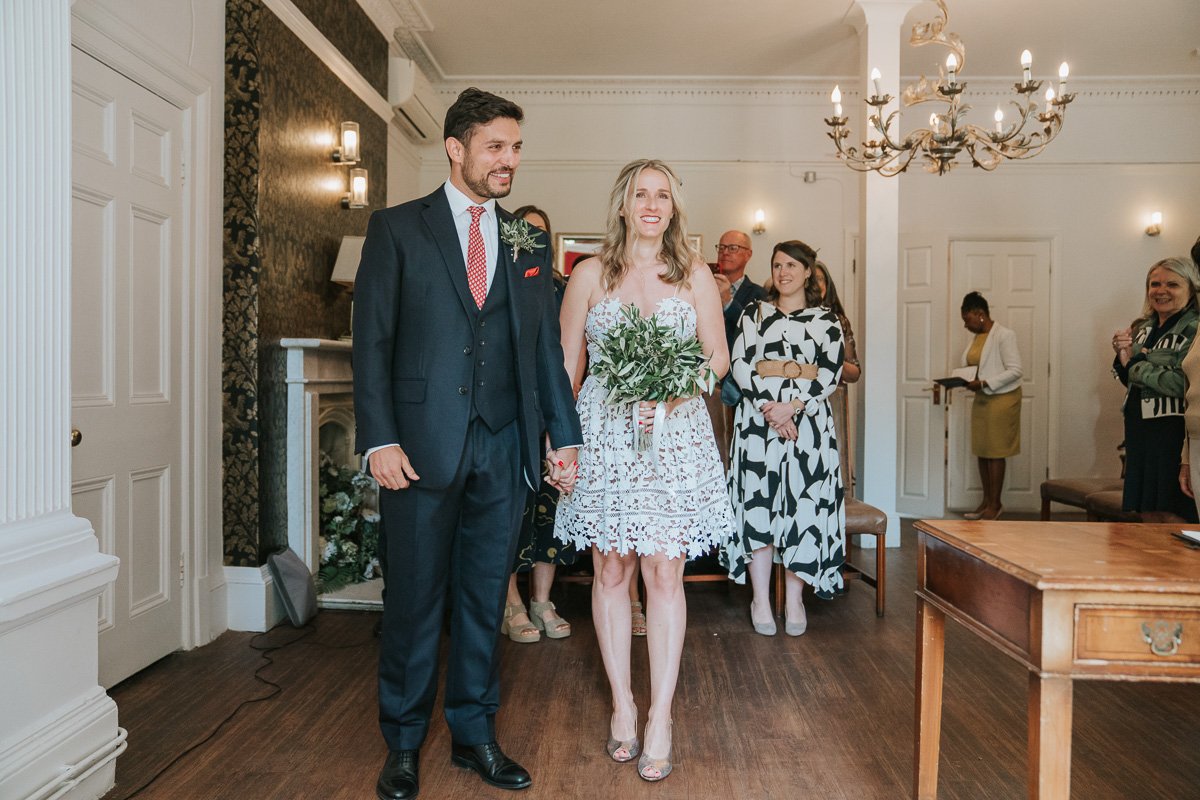  Bride and Groom facing the registrar in Southwark Register Office. 