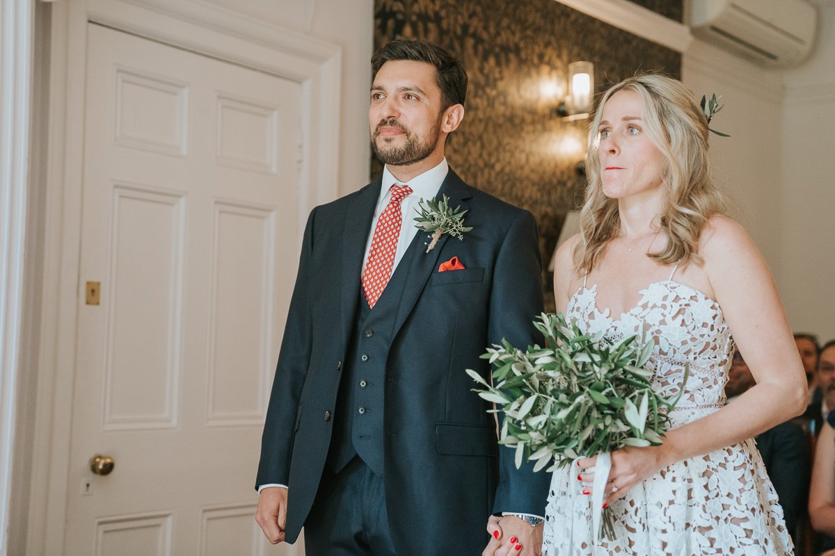  Bride and Groom facing the registrar in Southwark Register Office. 