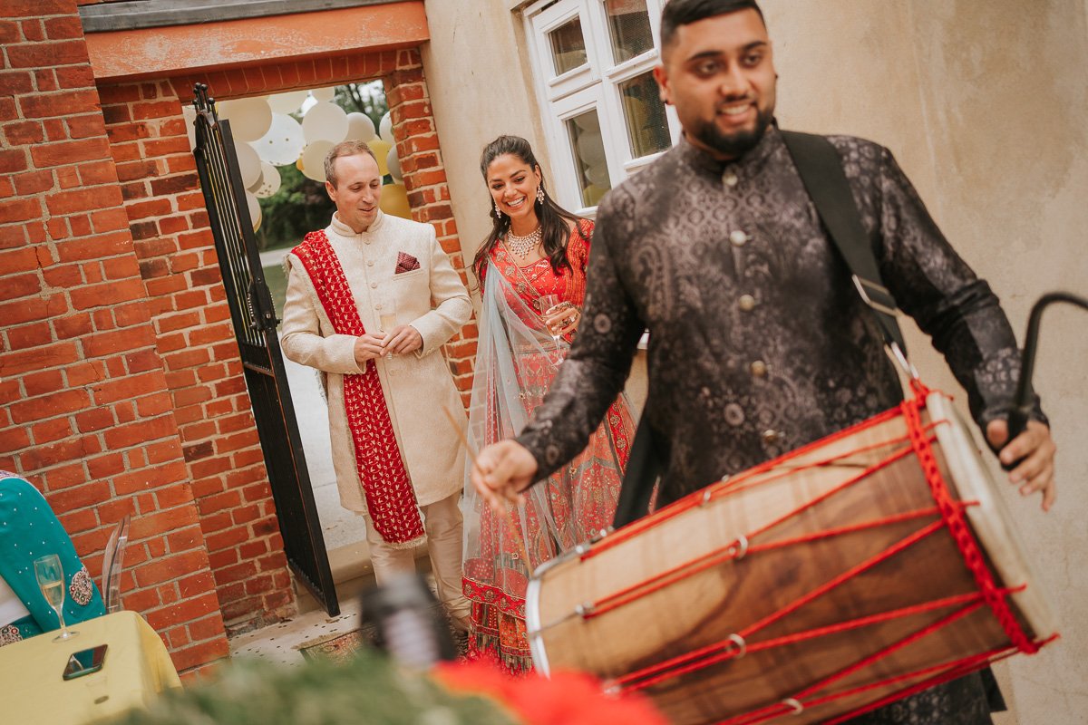  Bride and Groom make grand entrance to their Mehndi Party to the sound of drums playing. 