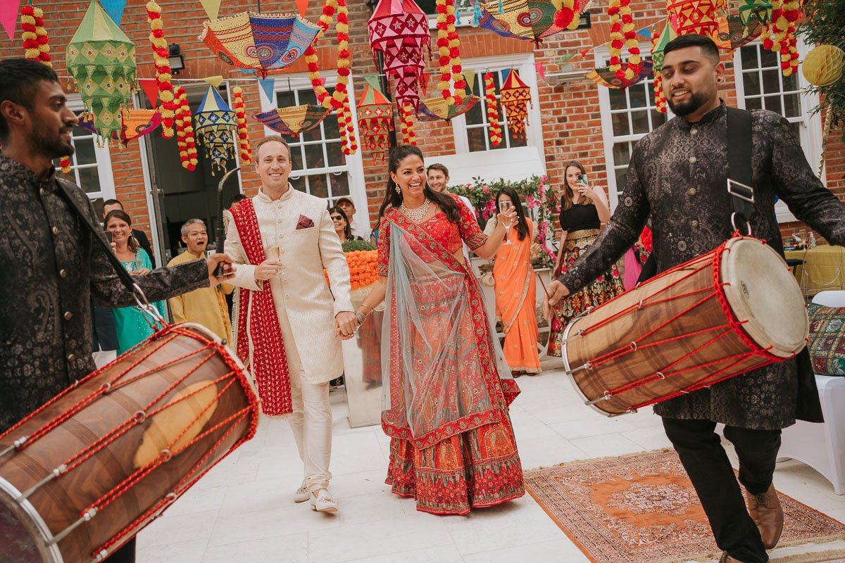  Bride and Groom make grand entrance to their Mehndi Party to the sound of drums playing. 