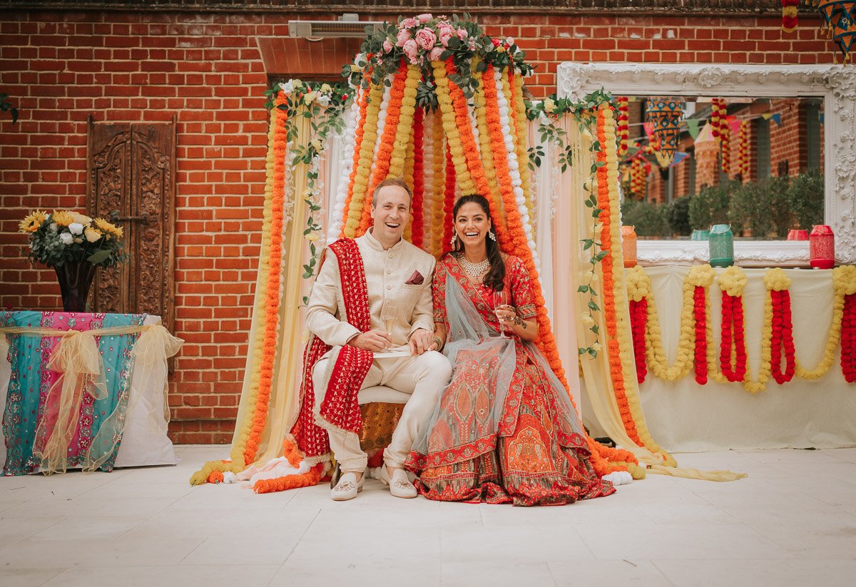  Bride and Groom sit together at their Mehndi Party. 