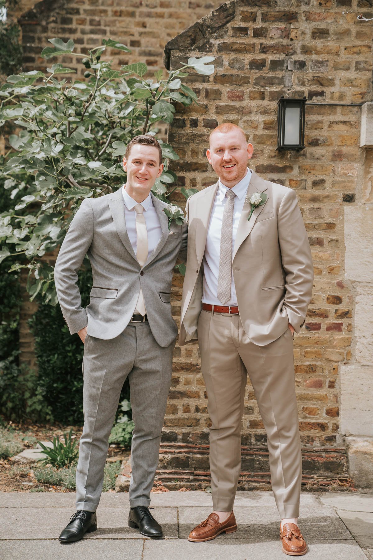  Groom and his best man stand outside St George’s Catholic Church. 