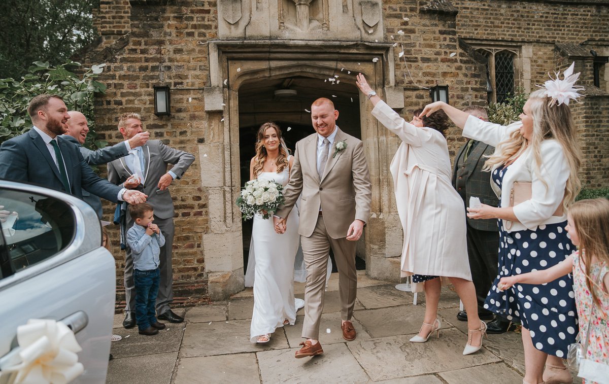  Bride and Groom get confetti thrown over them after their wedding in St George’s Catholic Church on Harrow Road. 