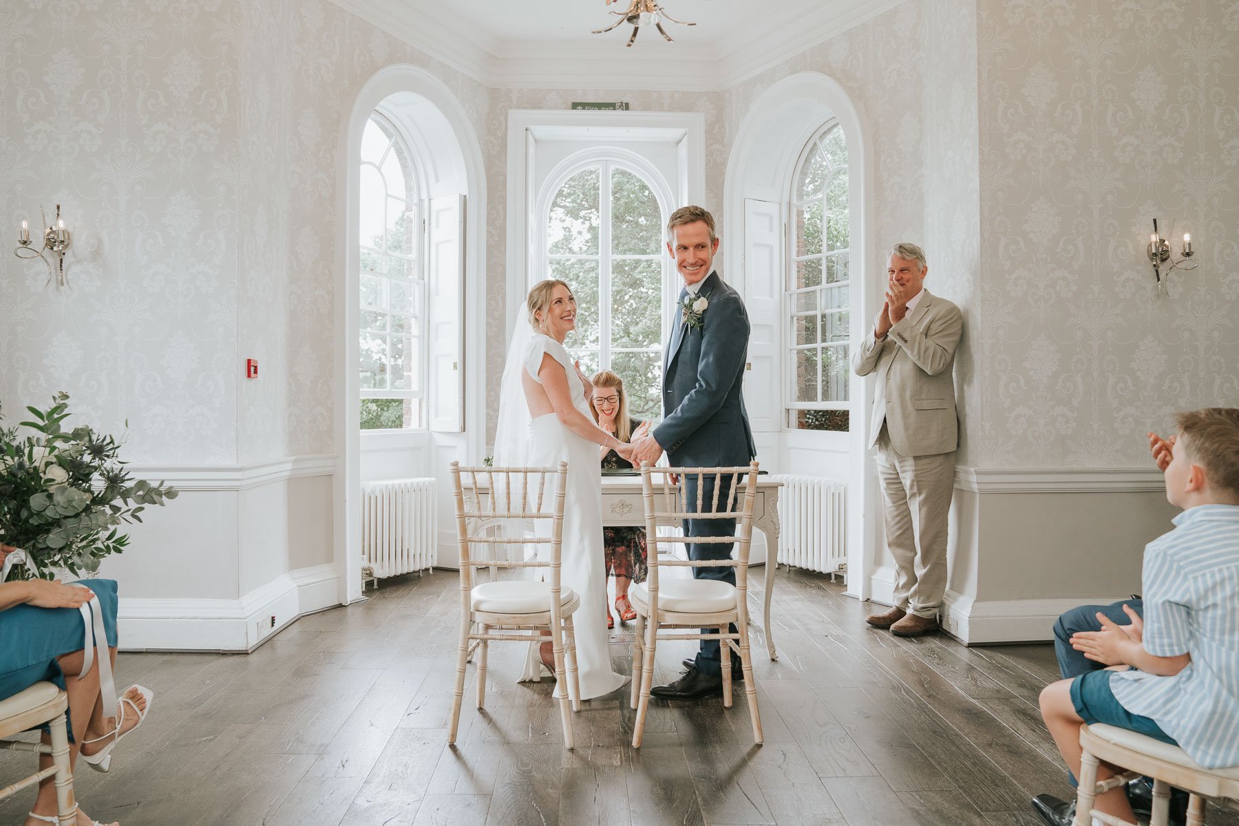  Bride and Groom exchange vows at Morden Park Hall House (Merton Register Office). 