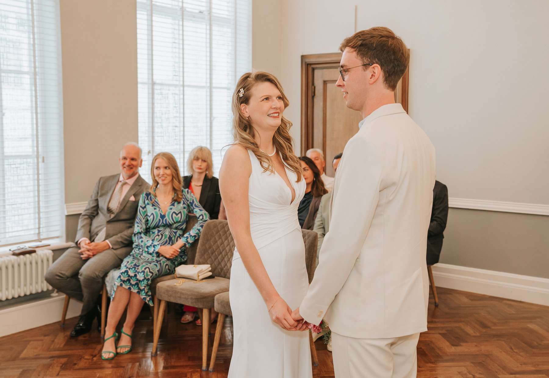  Oliwia and Jon looking into each other’s eyes during their wedding at Islington Town Hall Register Office. 