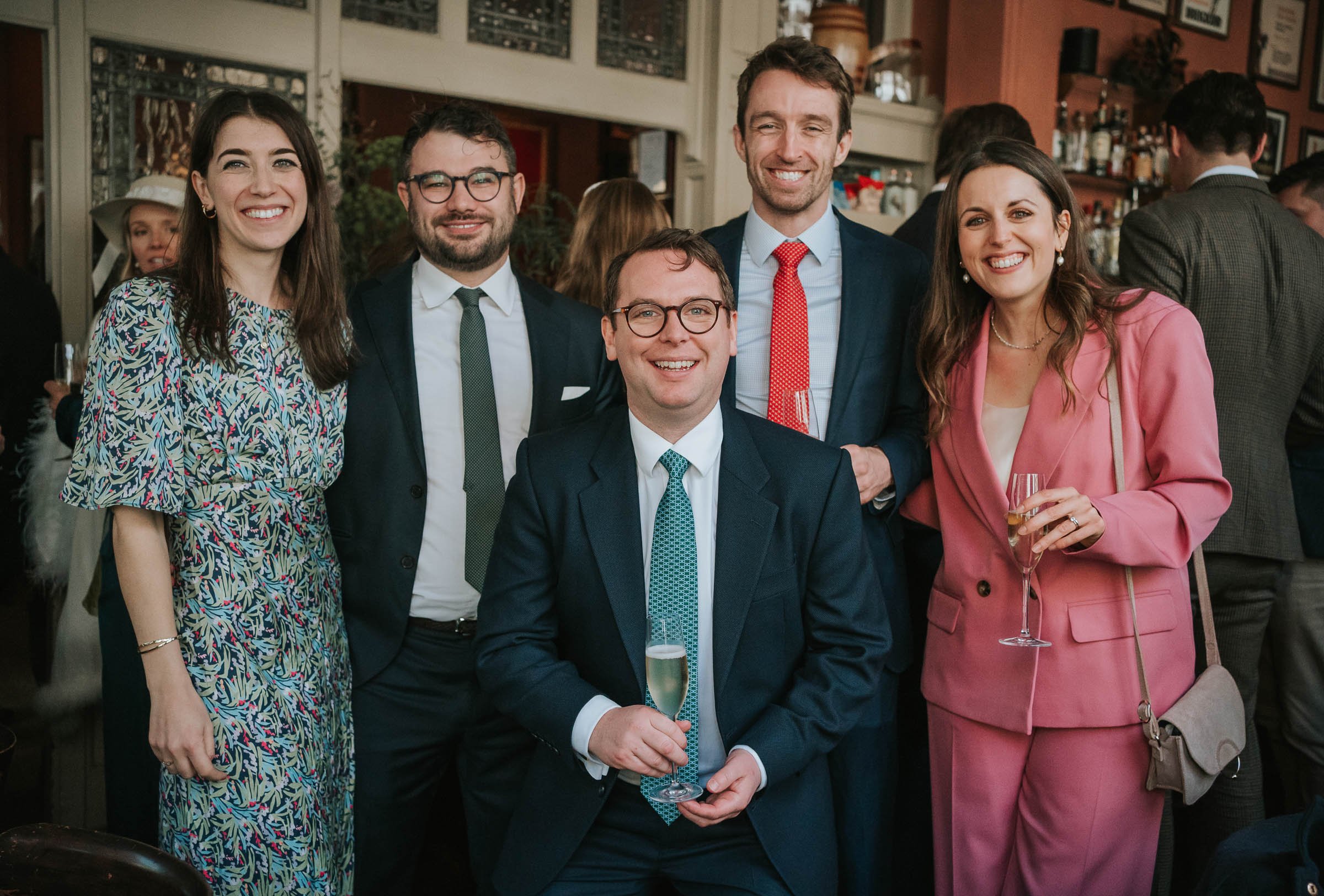  Wedding party posing for picture at the Surprise Pub in Chelsea. 