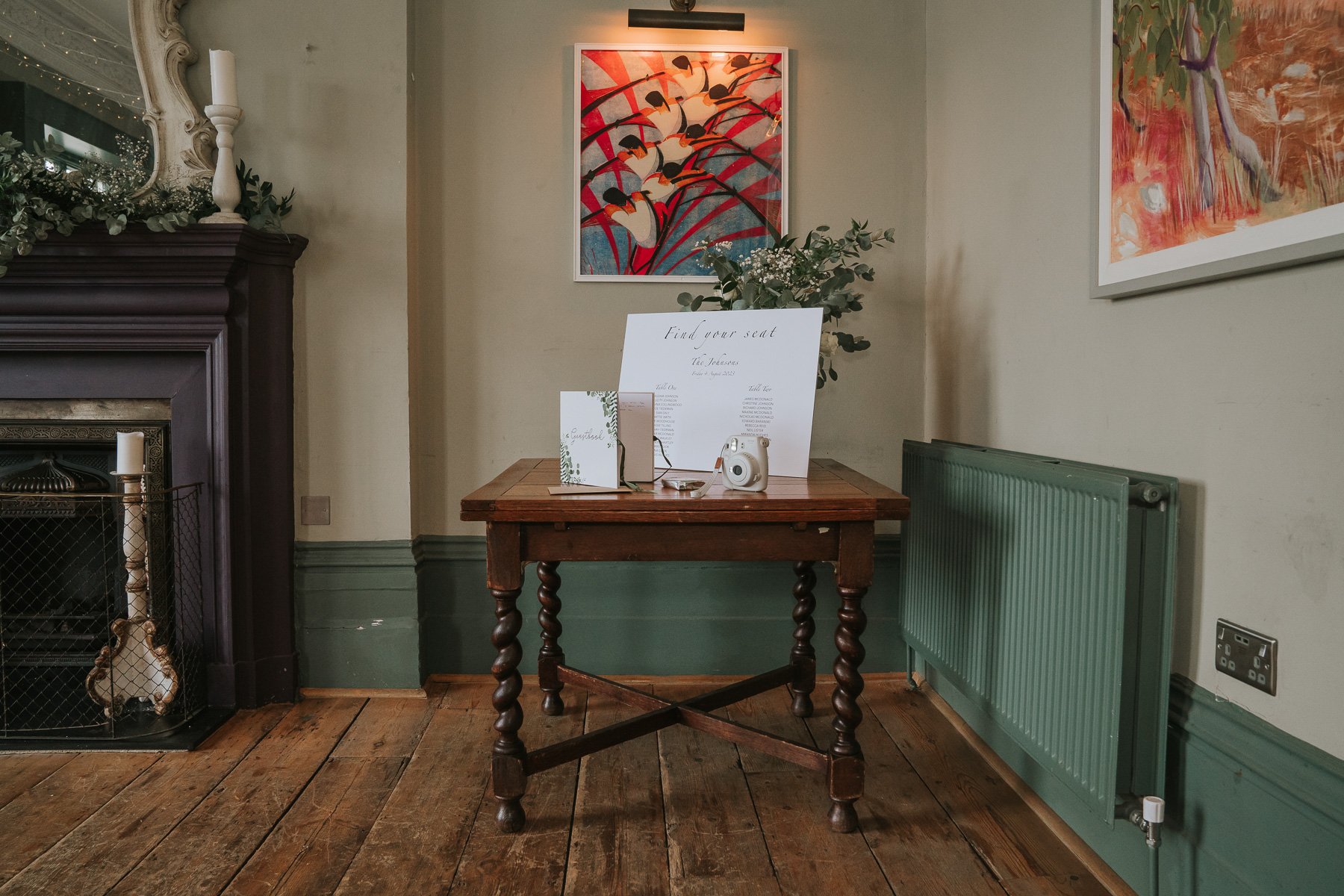  Corner of The Melrose Room in the Bulls Head pub, Barnes. Signing book and table plan are placed on the table. 