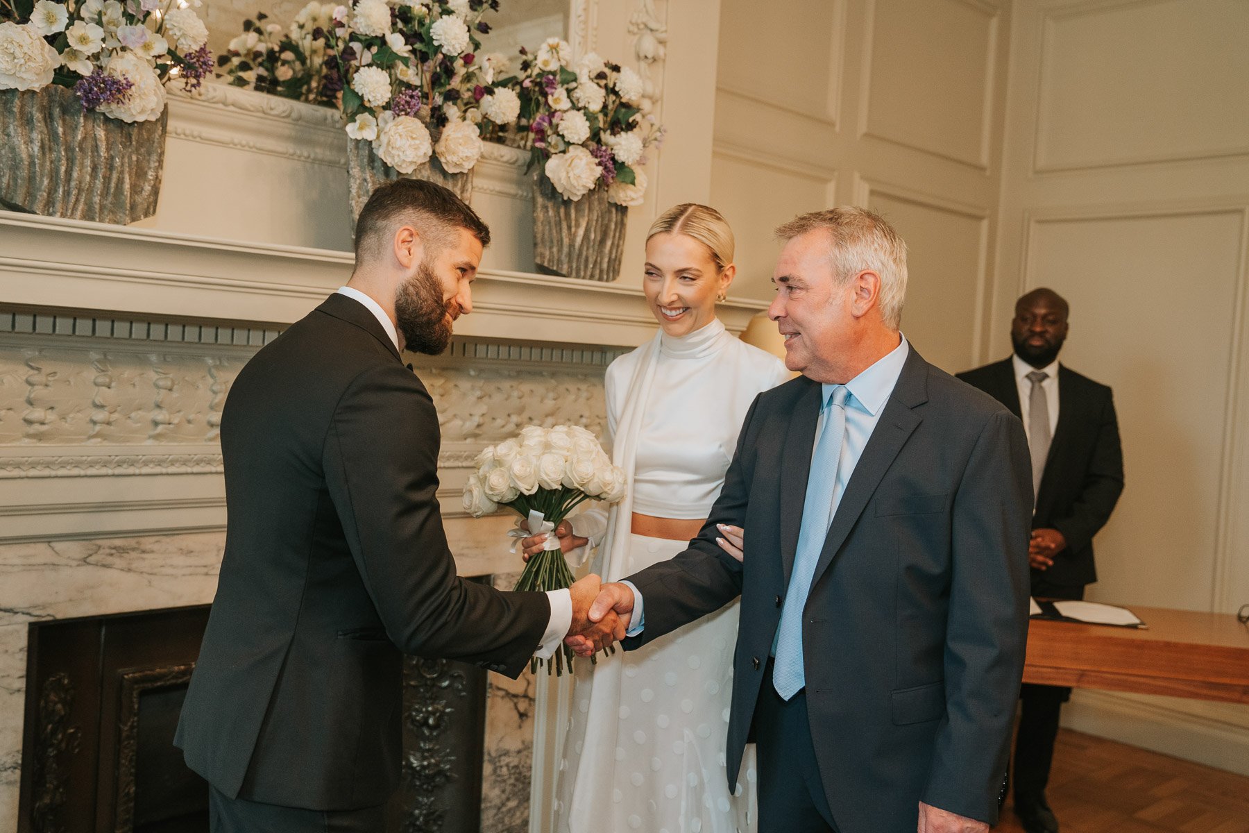  Bride given by father to groom in Pimlico Room of Marylebone Old Town Hall. 