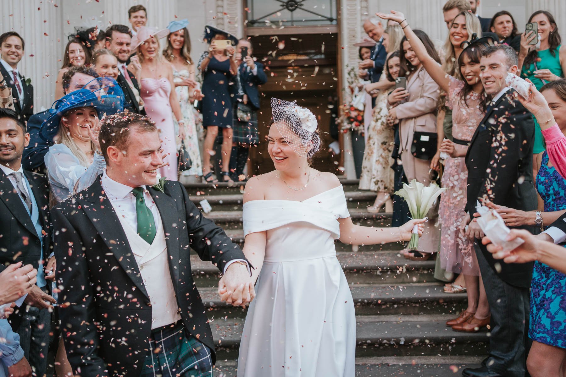  Newly married couple get showered with confetti after their wedding at Marylebone Old Town Hall. 