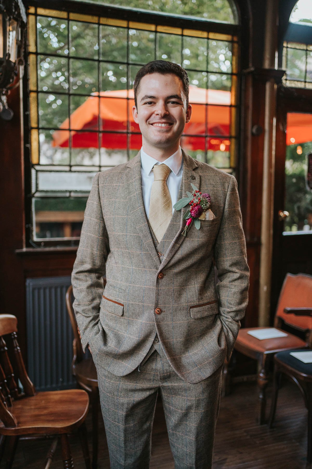  The groom all dressed up inside the prince albert pub in camden. 