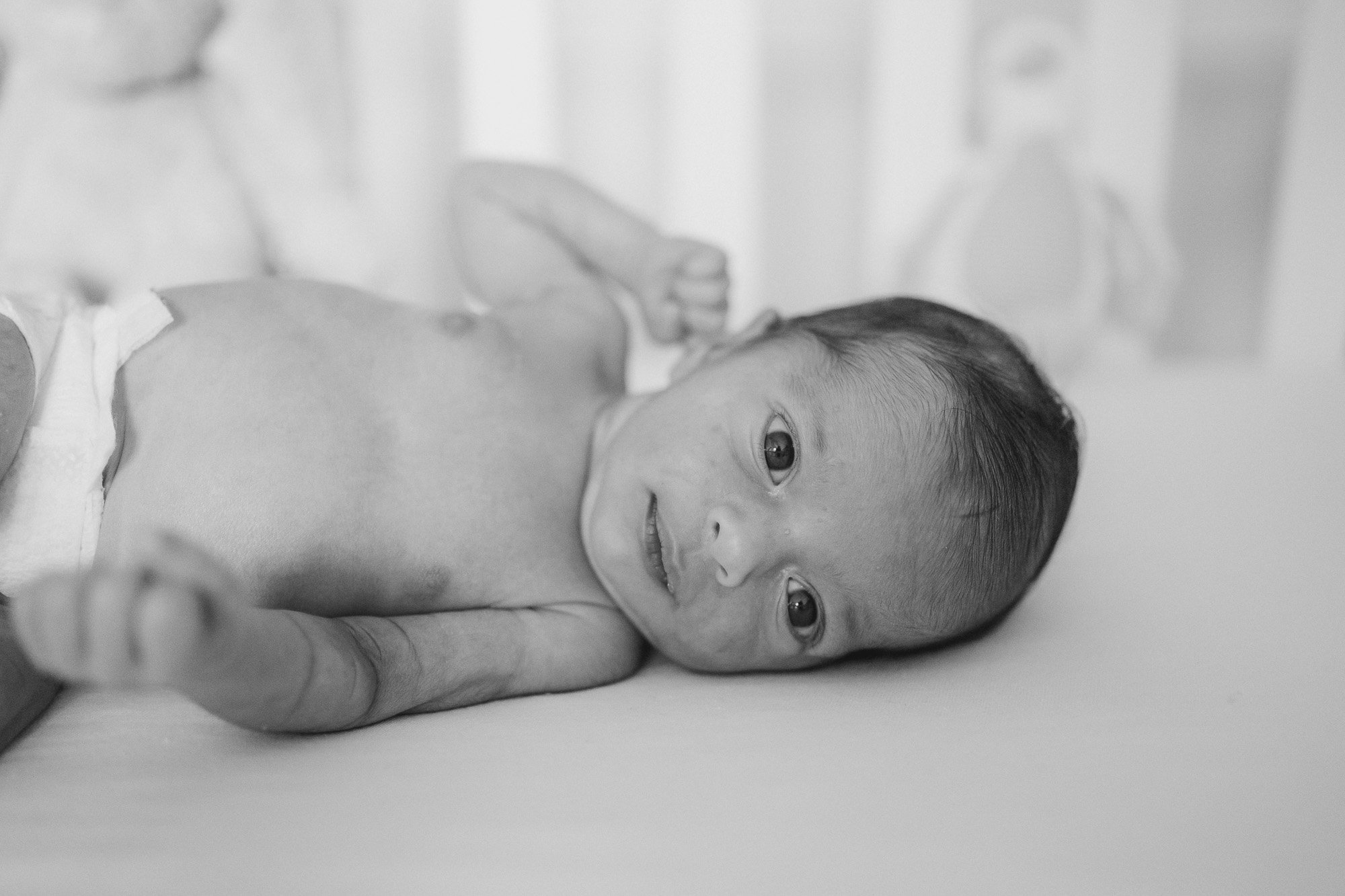 Newborn Baby in Cot.