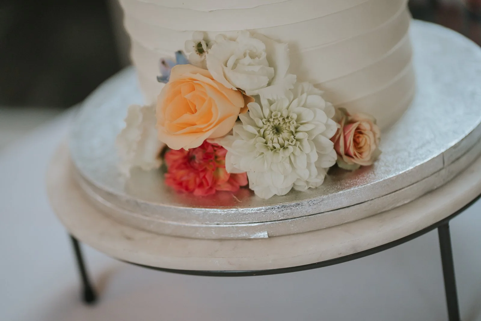 Close-up of floral wedding cake decoration