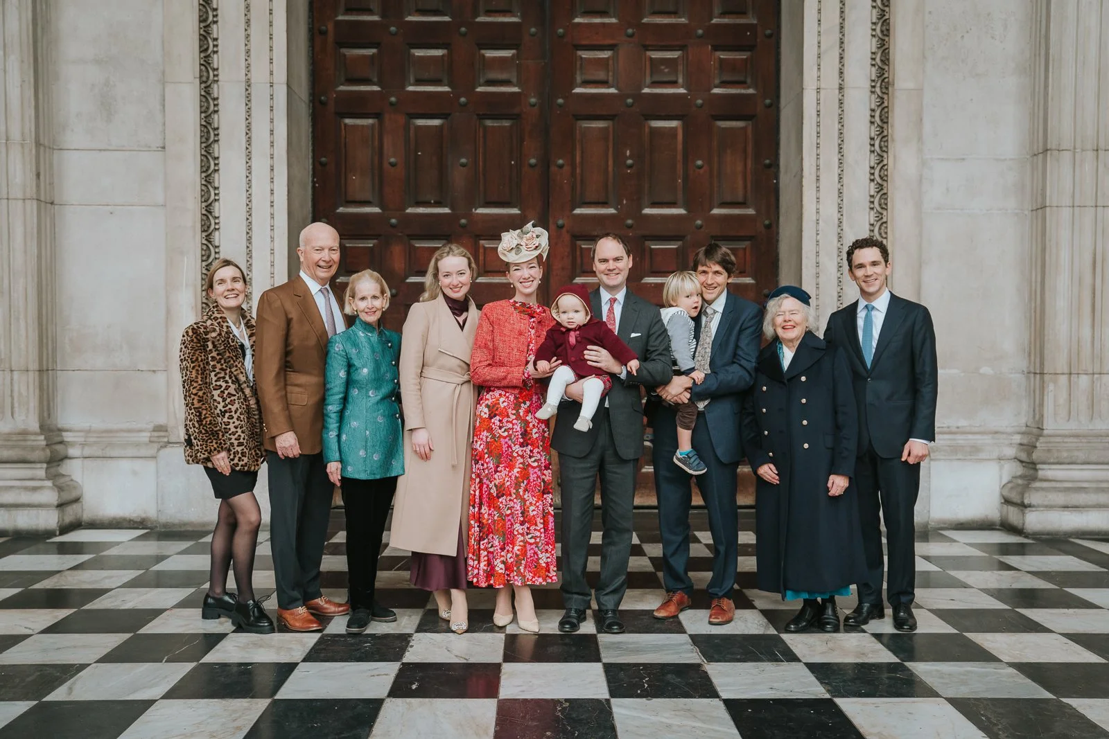 Multi-generation family group photo outside St Paul’s Cathedral following a christening, captured in natural daylight 