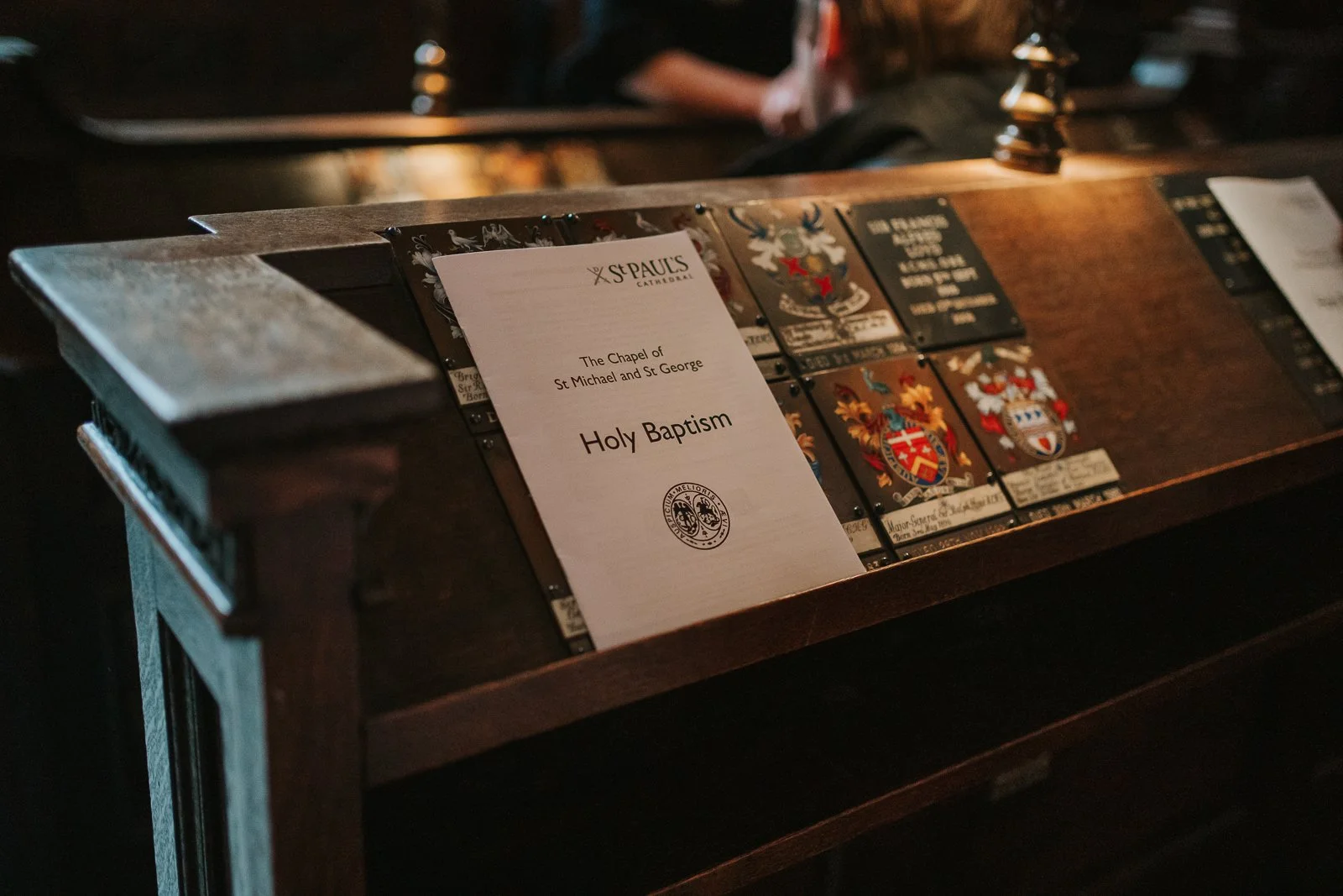  Christening service booklet reading “Holy Baptism” in the Chapel of the Order of St Michael and St George inside St Paul’s Cathedral, London 