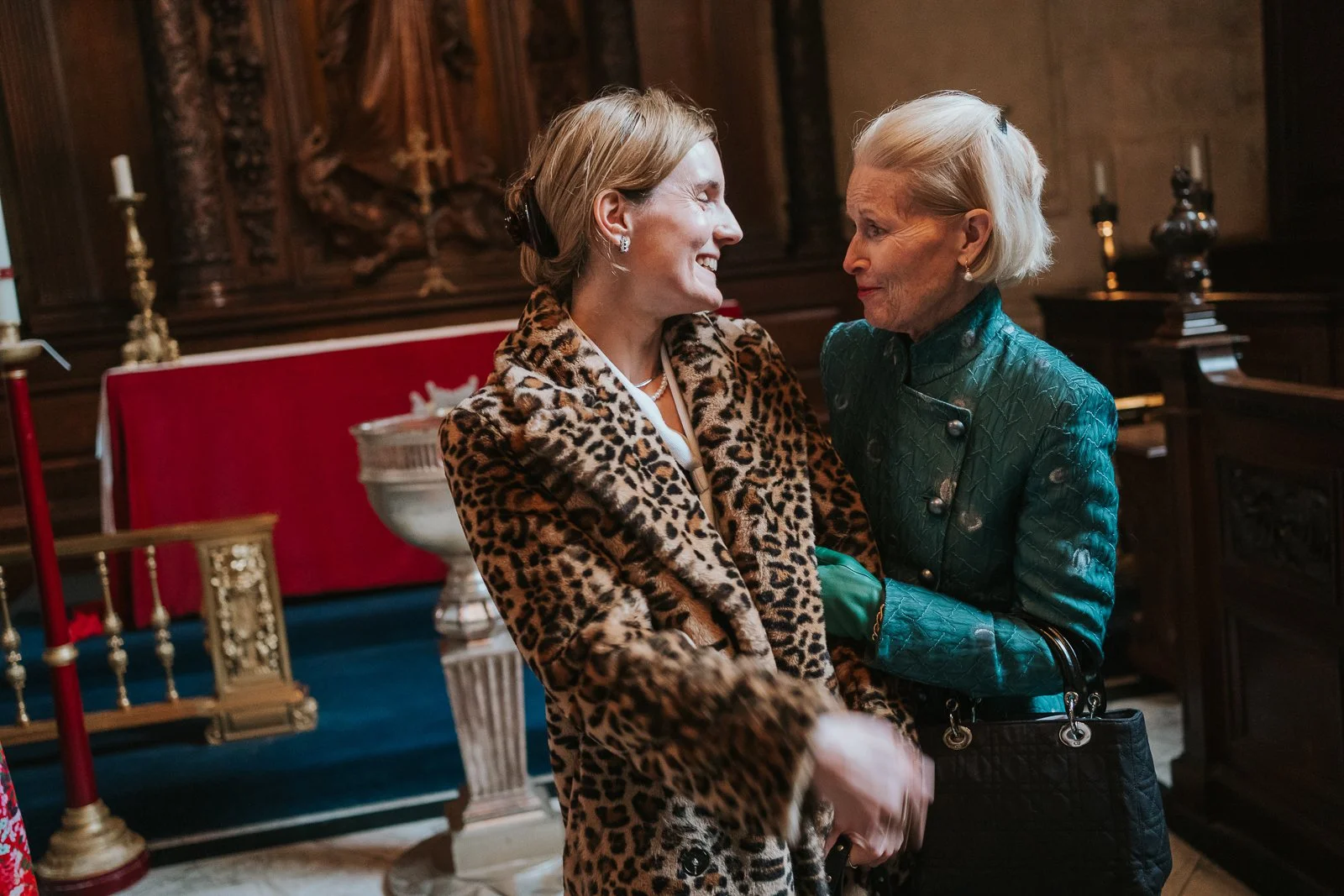  Candid moment between family members inside the Chapel of the Order of St Michael and St George during a St Paul’s Cathedral christening 