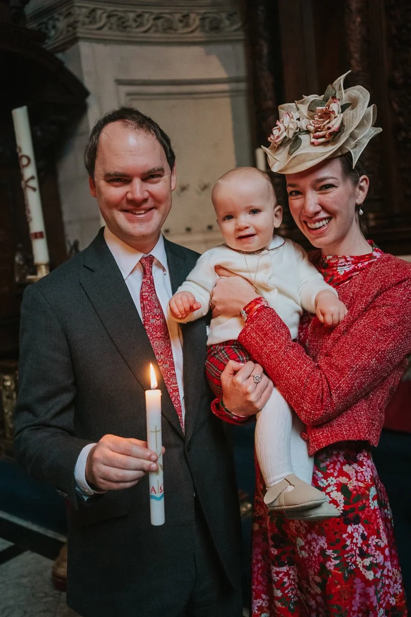  Close-up family christening photo inside the Chapel of the Order of St Michael and St George at St Paul’s Cathedral, candlelit and atmospheric 