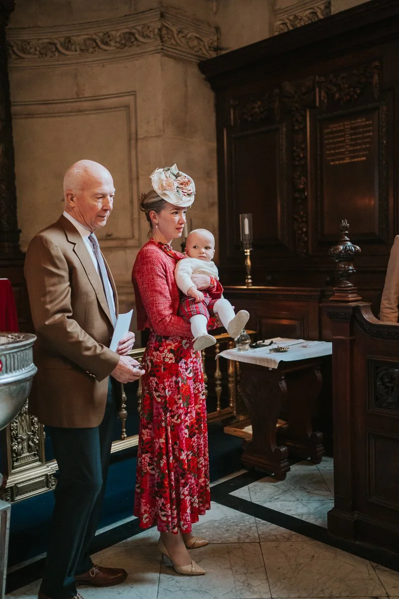  Priest and mother with baby during a christening inside the Chapel of the Order of St Michael and St George, St Paul’s Cathedral, London 