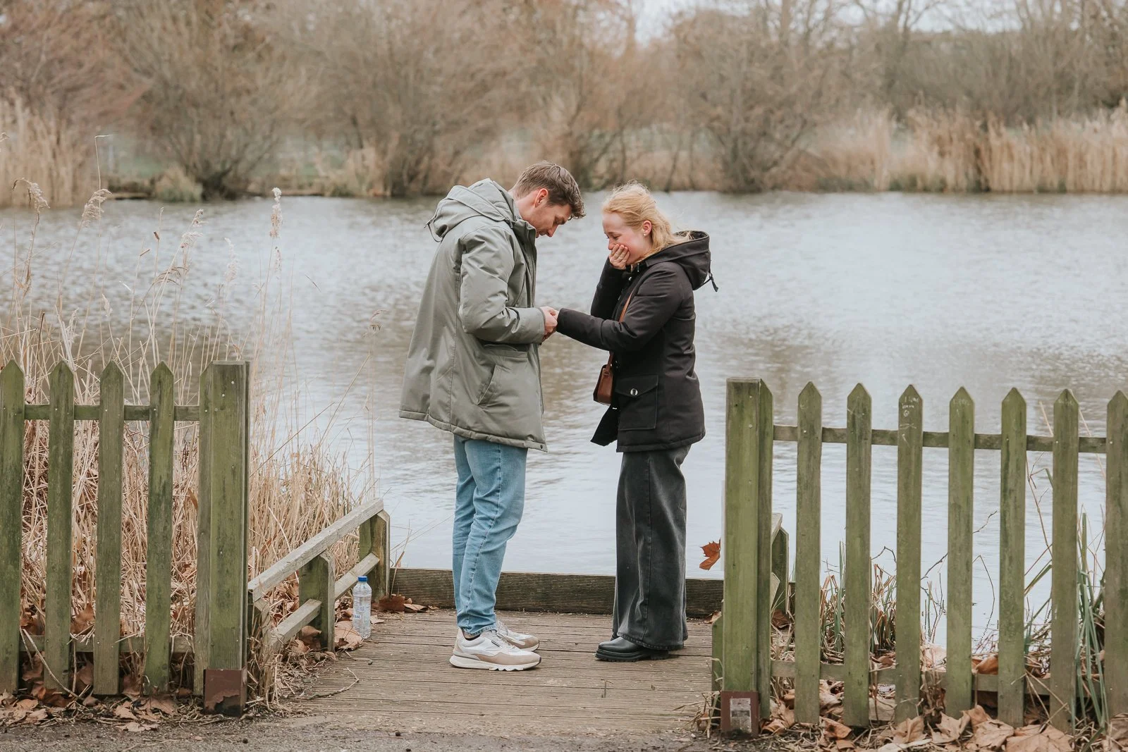  Engagement ring moment at Clapham Common lake as newly engaged couple celebrate their London proposal. 