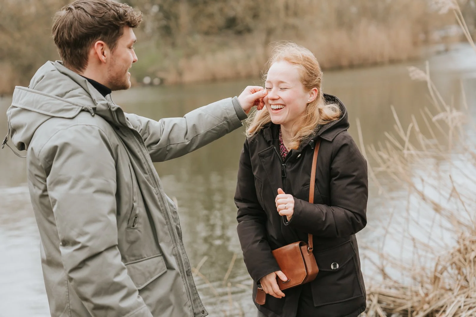  Joyful moment after surprise proposal at Clapham Common, candid London engagement photography. 