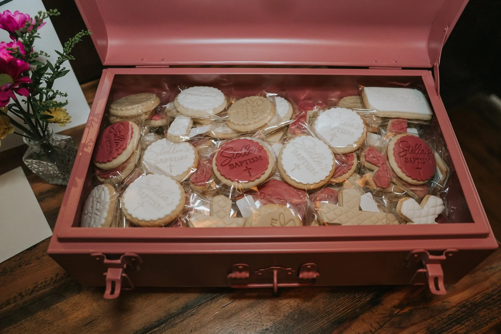  Personalised christening biscuits displayed in a pink keepsake box at Westow House pub in Crystal Palace. 