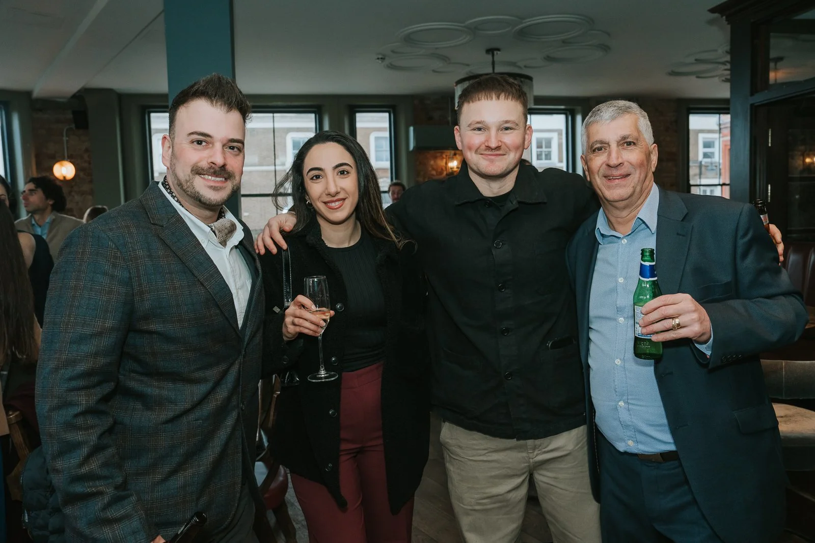  Friends and family posing together at Westow House following a christening at St Constantine &amp; St Helen Church. 