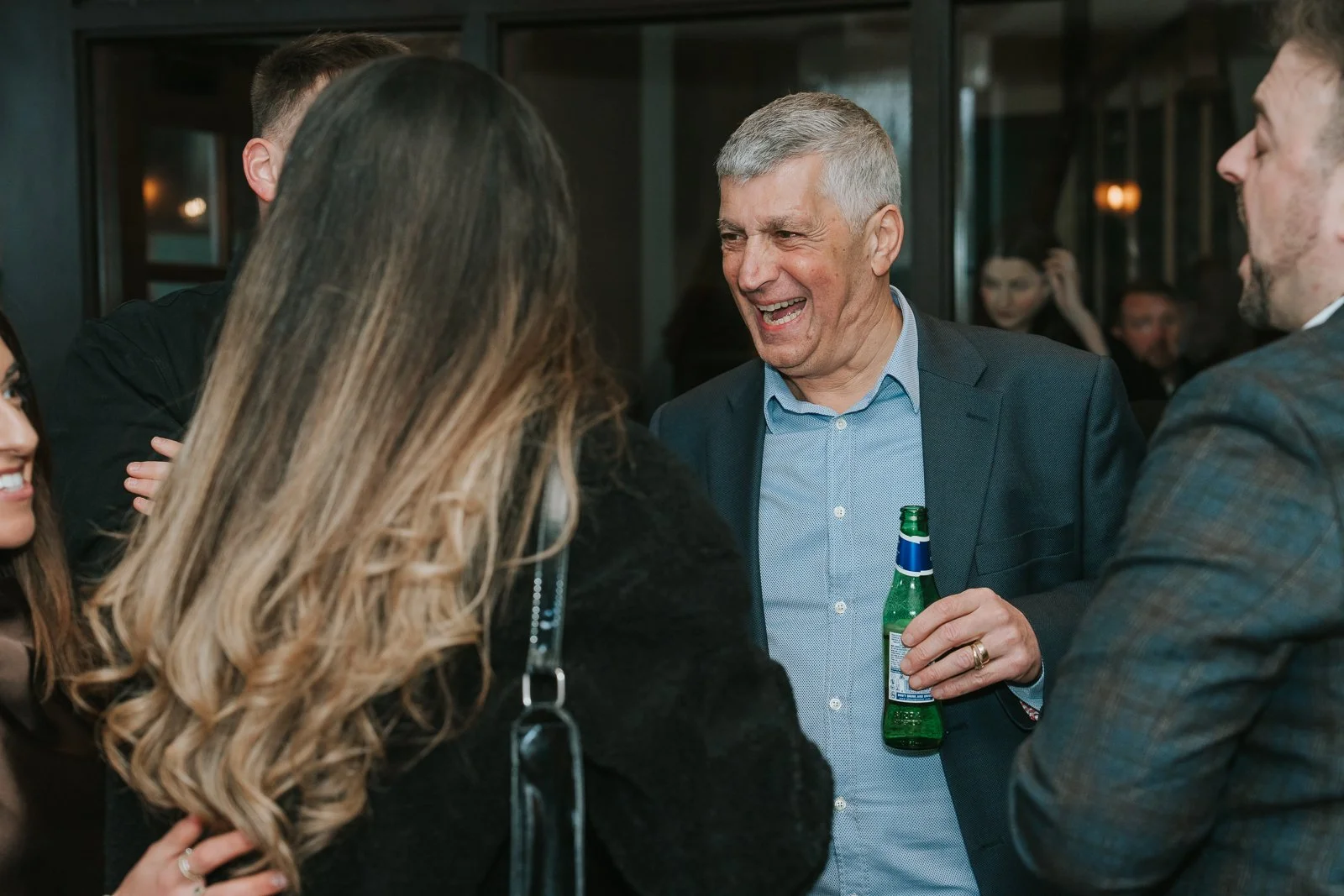  Guest laughing during a relaxed christening party at Westow House pub in SE19. 