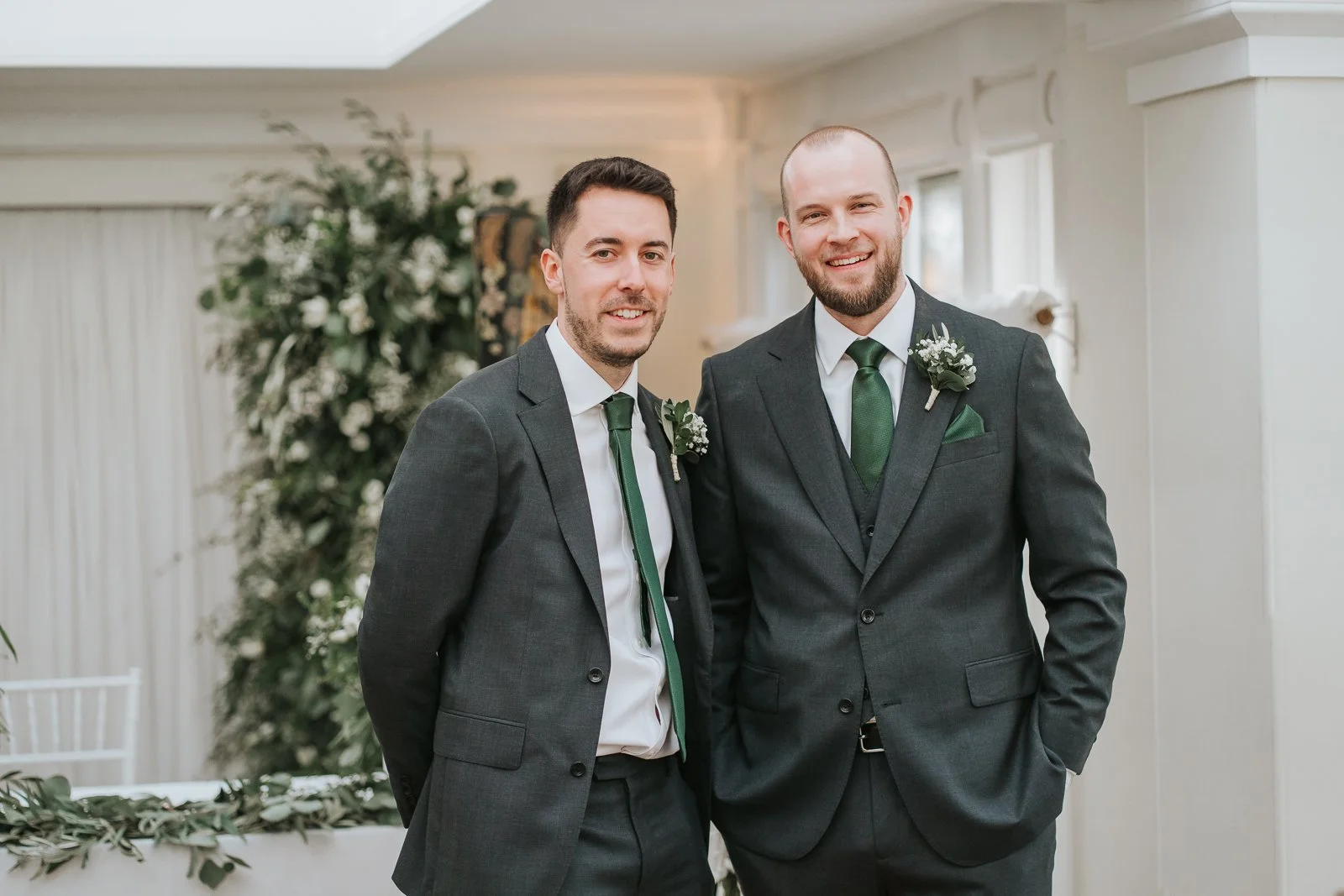  Groom and groomsman portrait inside the Belvedere Suite at Pembroke Lodge in Richmond Park, elegant London wedding ceremony room filled with natural light. 
