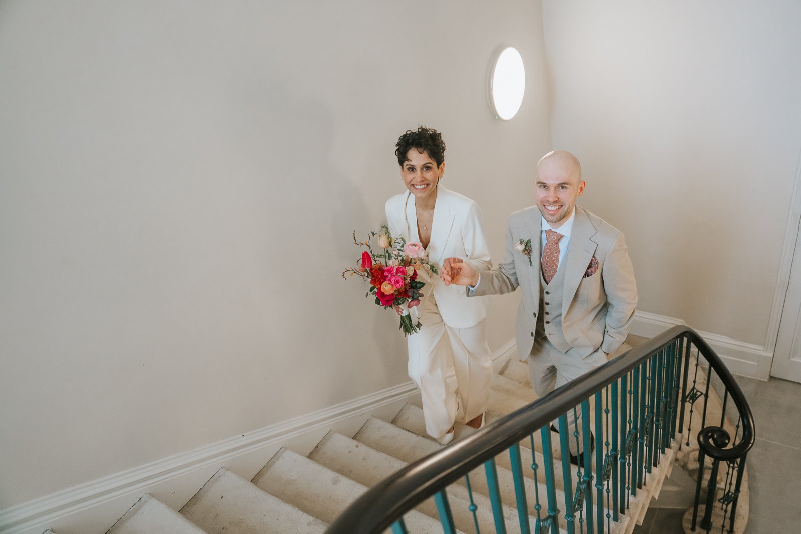  Brockwell Hall wedding photographer capturing couple on staircase in natural light. 