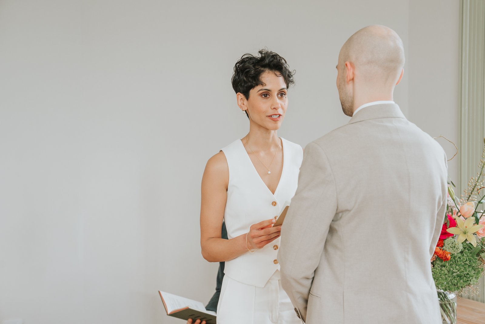  Bride exchanging vows during ceremony at Brockwell Hall, emotional close-up moment in South London wedding venue. 