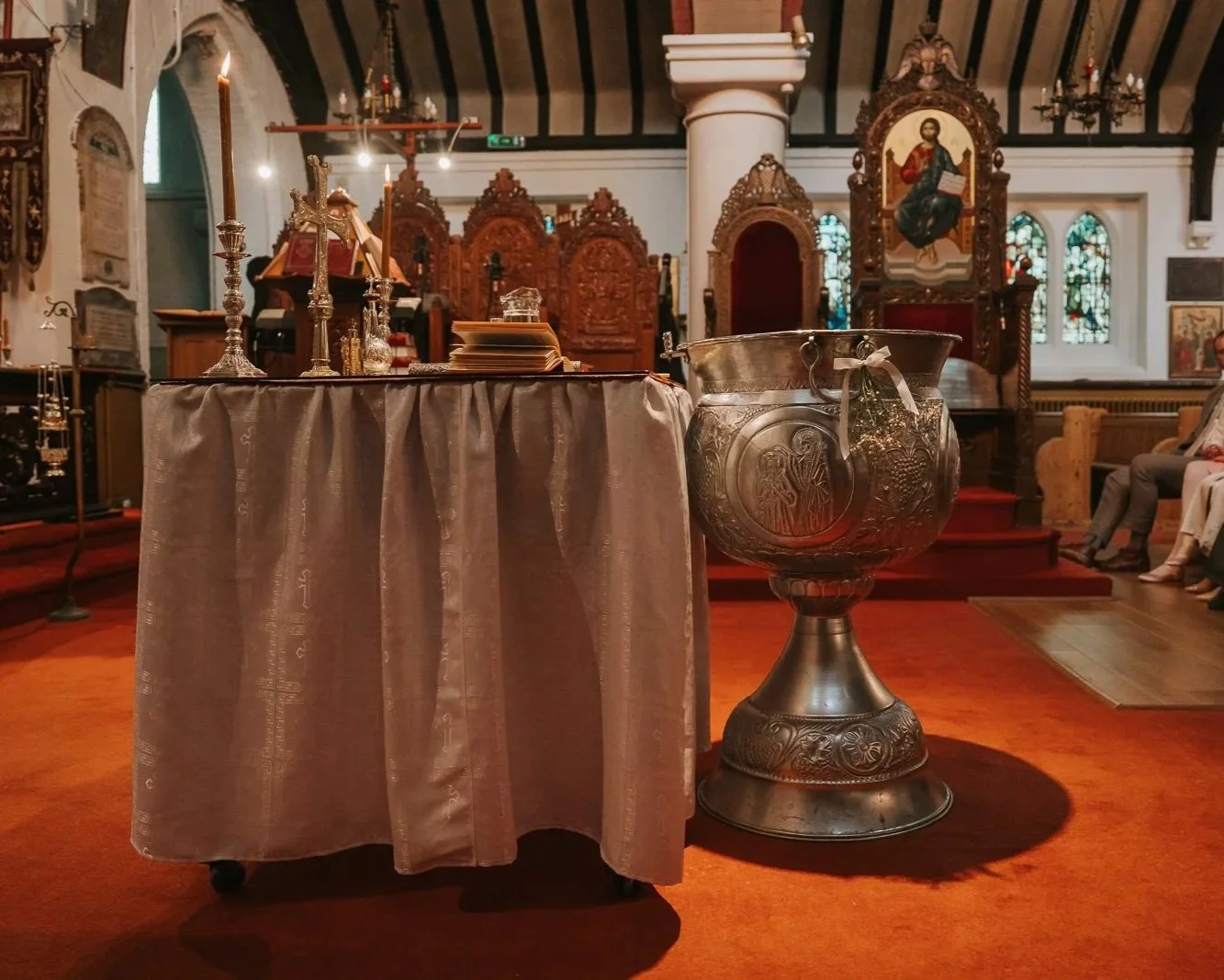  Traditional Greek Orthodox baptism font prepared for a christening ceremony inside St Nicholas Greek Orthodox Church, Shepherd’s Bush, London. 