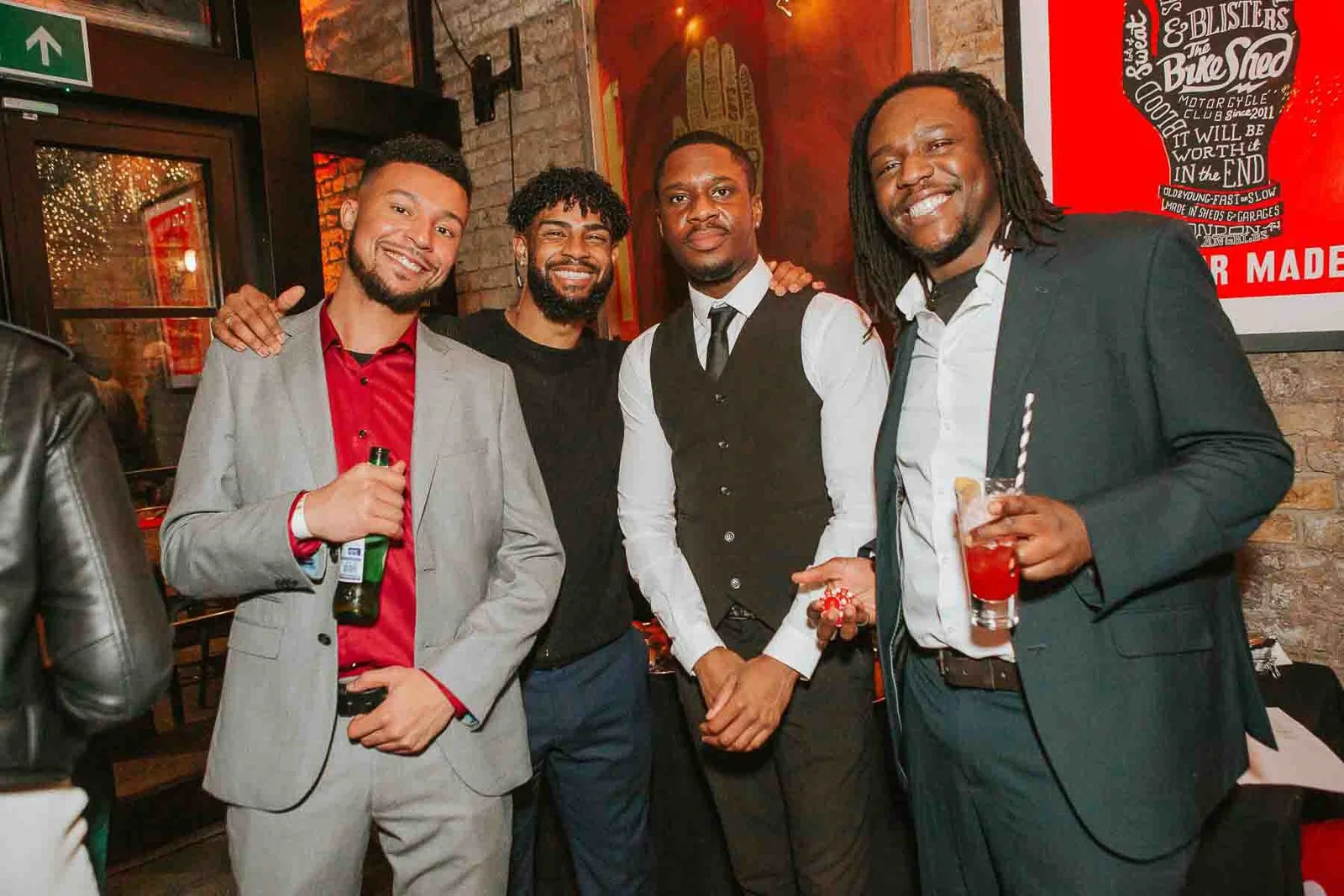  Guests posing for a group photo at a lively 30th birthday party in South London, captured by a Balham birthday party photographer. 