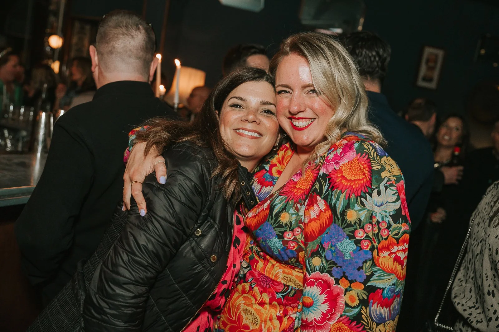 Birthday guest posing with the host during a relaxed 40th birthday celebration, captured by a London party photographer. 