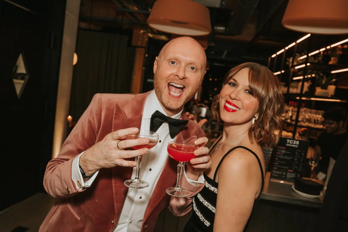  Guests celebrating a 40th birthday party with cocktails and smiles at a vibrant South London birthday event. 