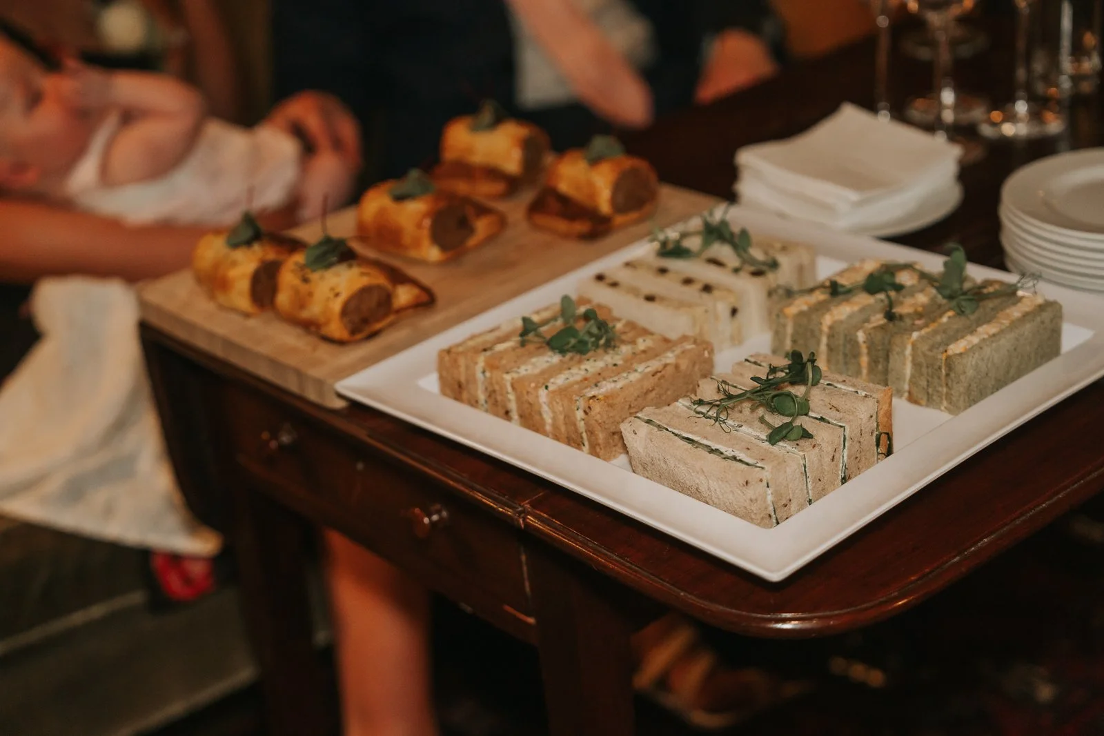  Selection of gourmet sandwiches and sausage rolls served during a wedding reception at The Zetter Townhouse Clerkenwell. 