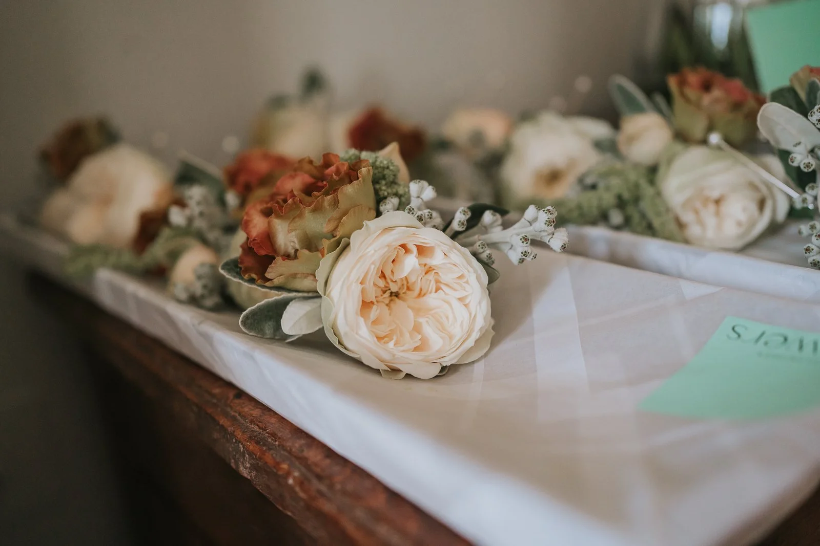  Soft, romantic wedding flowers featuring cream roses and seasonal blooms arranged for a wedding at The Zetter Townhouse Clerkenwell. 