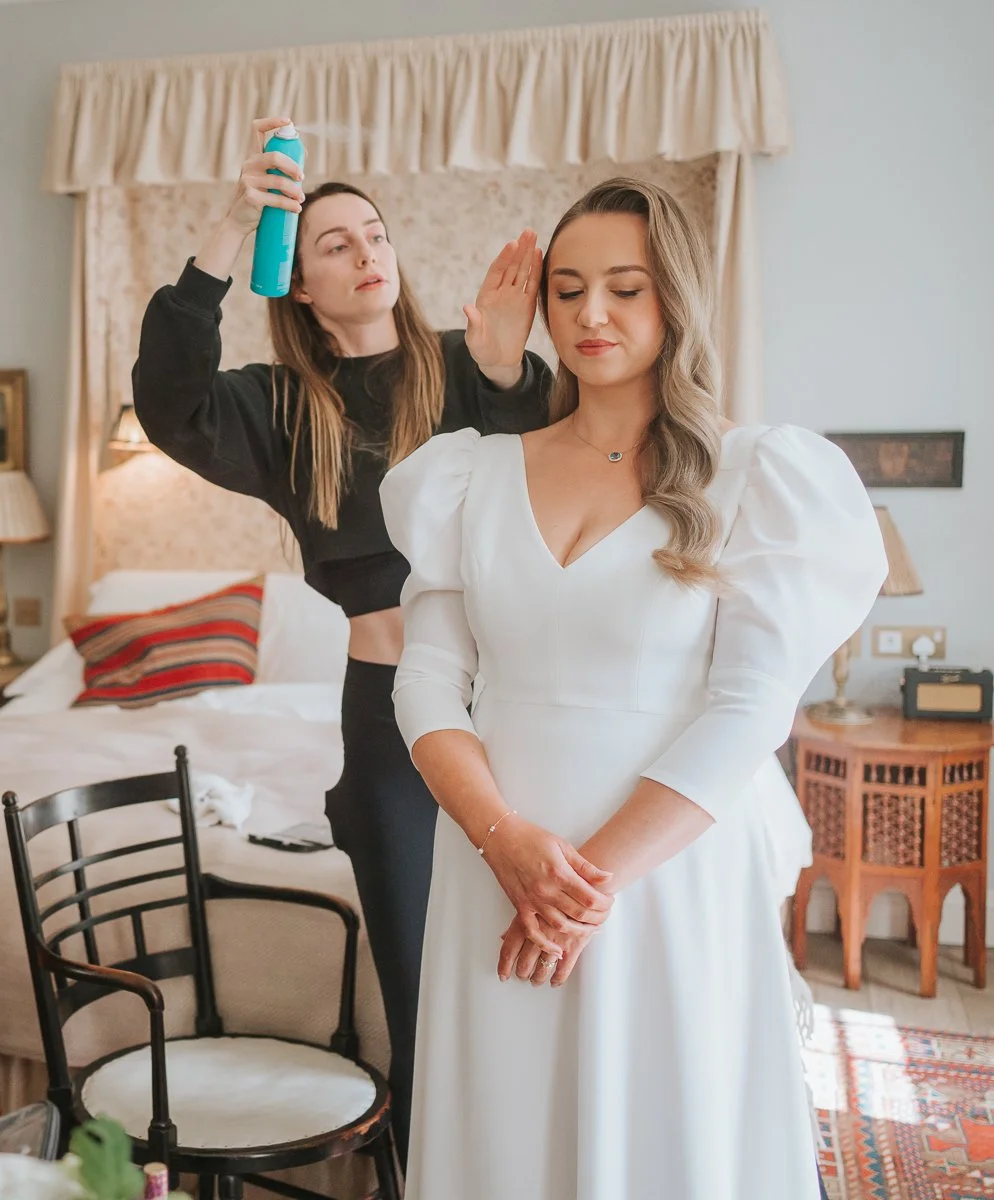  Bridal hair and makeup finishing touches before a wedding ceremony at The Zetter Townhouse Clerkenwell in London. 