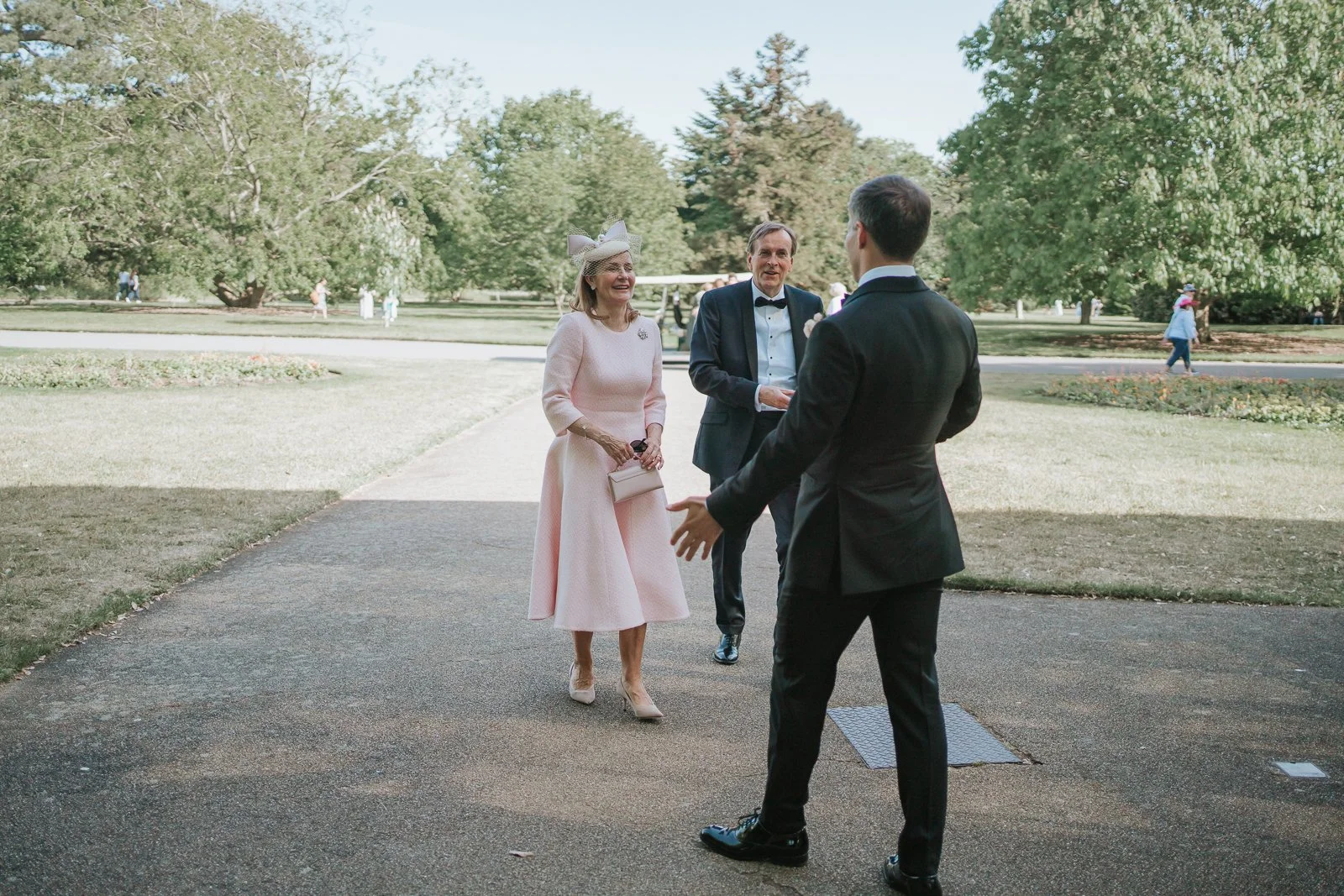  Groom greeting family members outside the Nash Conservatory at Kew Gardens ahead of the wedding ceremony. 