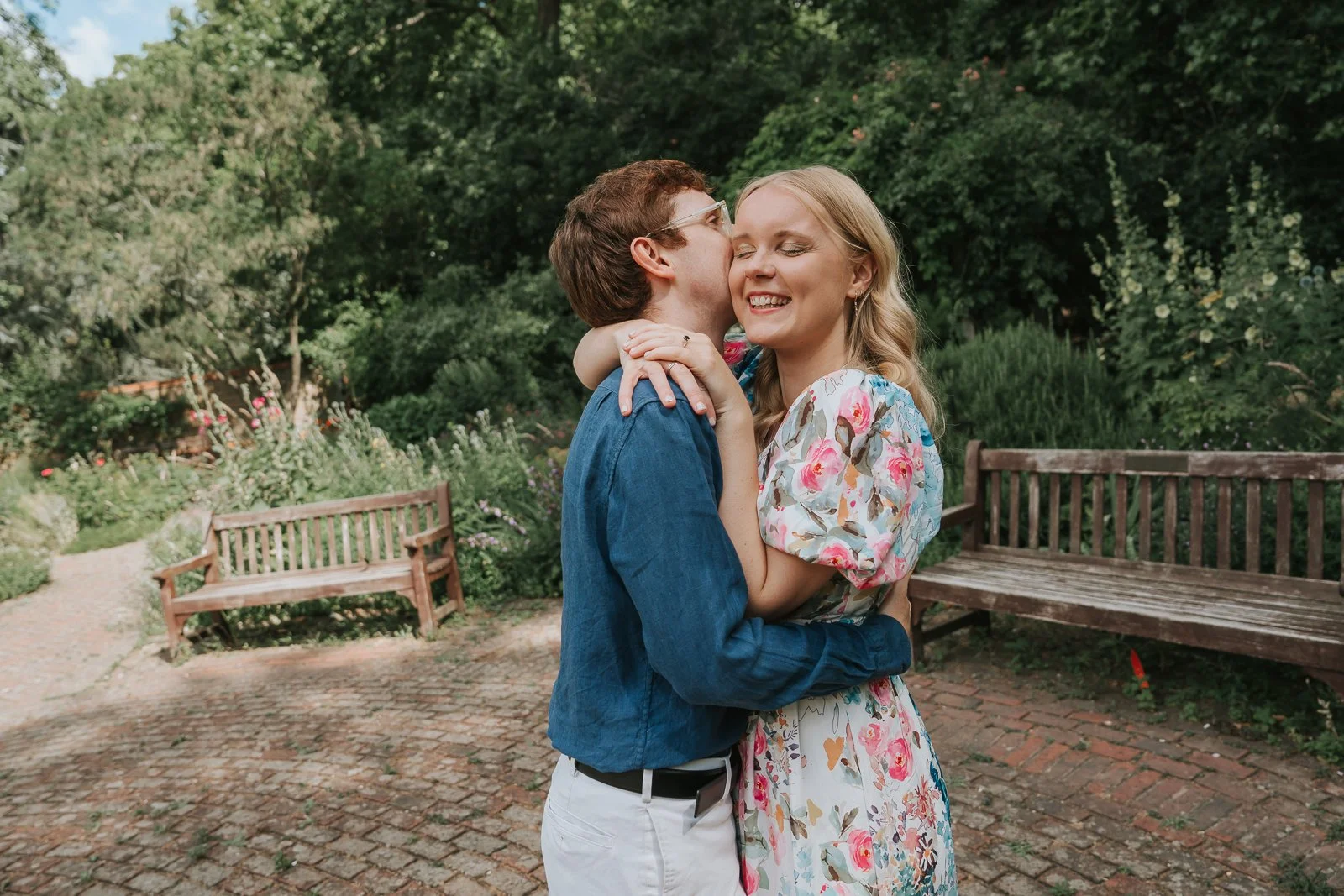  Romantic engagement photo in Battersea Park, London, capturing a couple embracing in the rose garden as they share a tender moment during their pre-wedding photoshoot. 