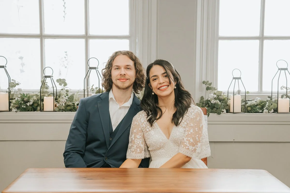  Newly married couple smiling together after their intimate civil ceremony at Kingston Register Office. 