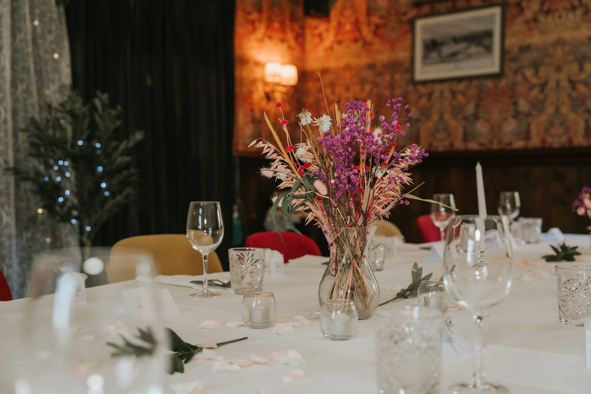  Colourful dried-flower centrepiece on a wedding table inside the Trinity Room at the County Arms in Wandsworth. 