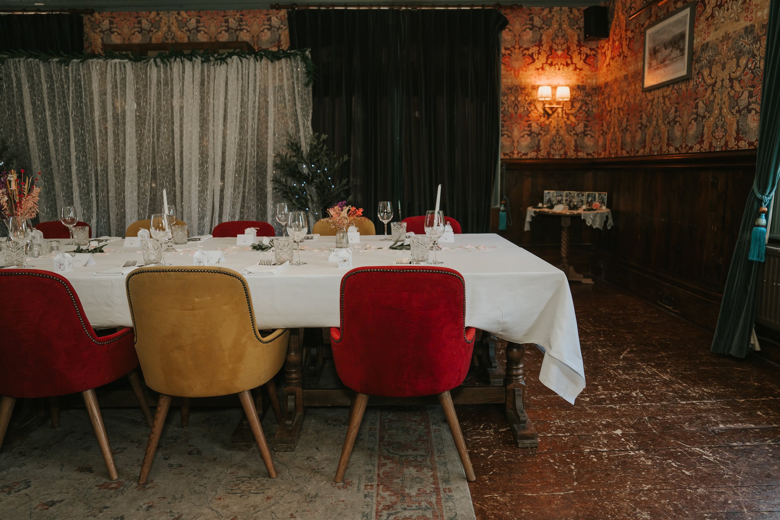  Intimate wedding table setting beside the fairy-light backdrop in the Trinity Room at the County Arms in Wandsworth. 